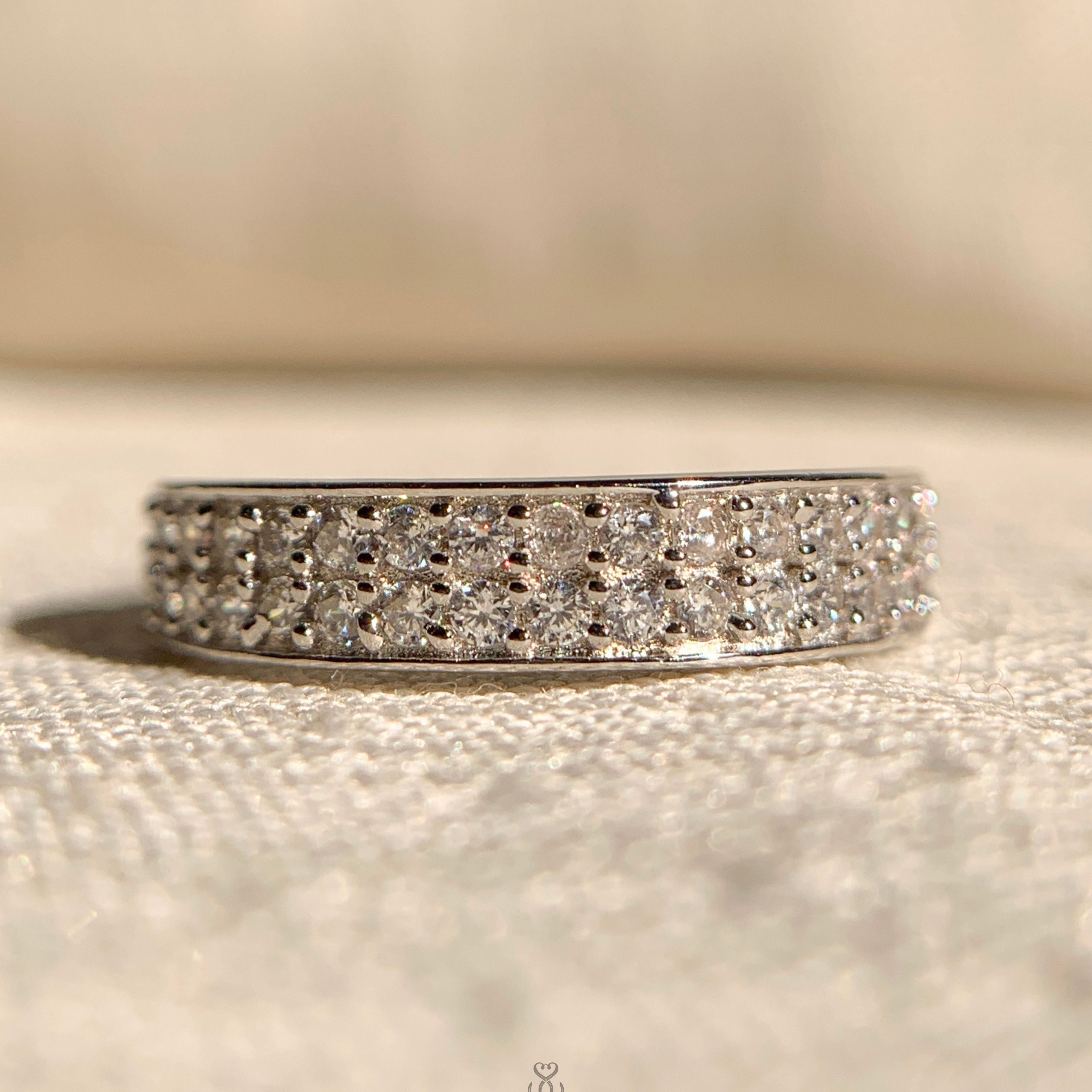 Double row round diamond channel set wedding band in white gold